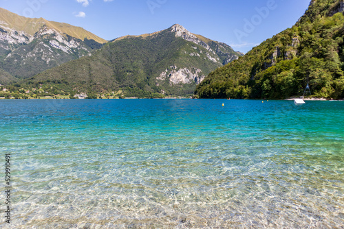 View of Lake Ledro with the mountains in the background. © constantin