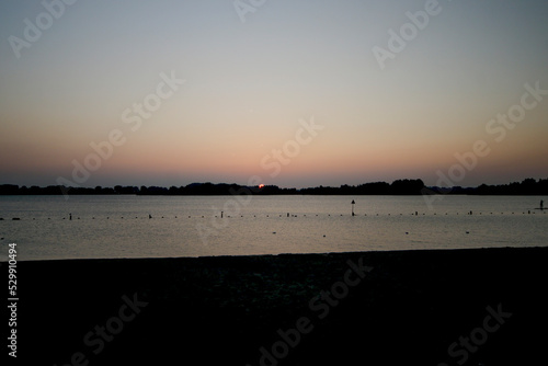 Sunset over the Zevenhuizerplas in Rotterdam Nesselande district photo