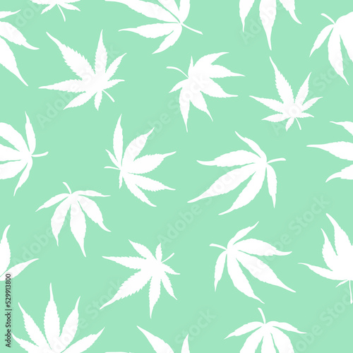 Seamless pattern of white cannabis leaves on a green background. White hemp leaves on a blue background. 