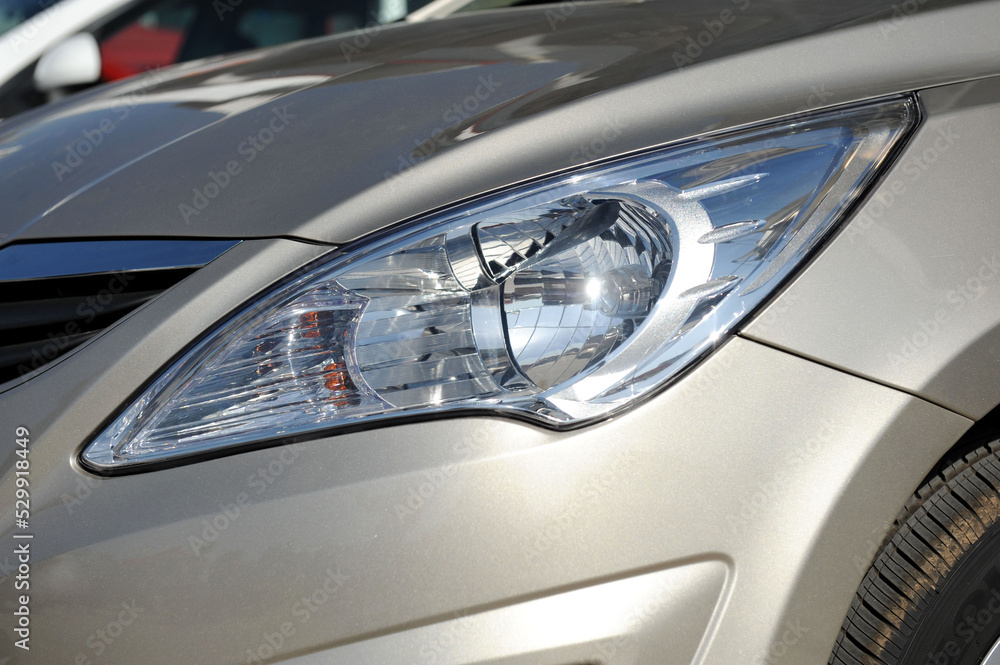 Local close-up of headlights of small cars