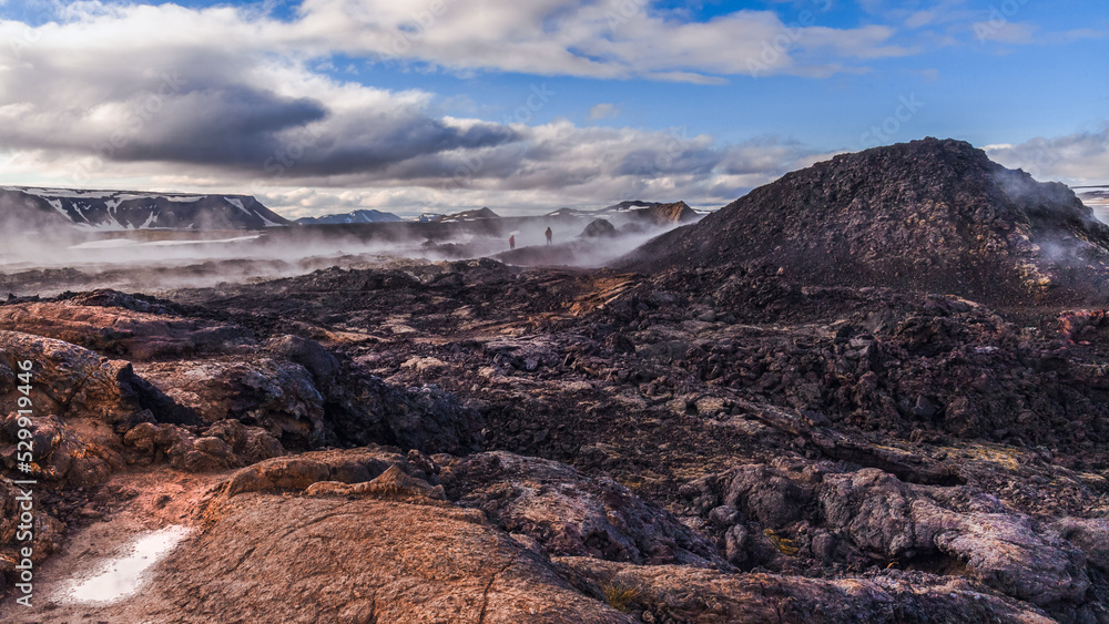 Fototapeta premium The Krafla Lava Fields Leirhnukur Hot Spring Area Iceland.Black lava and steam.
