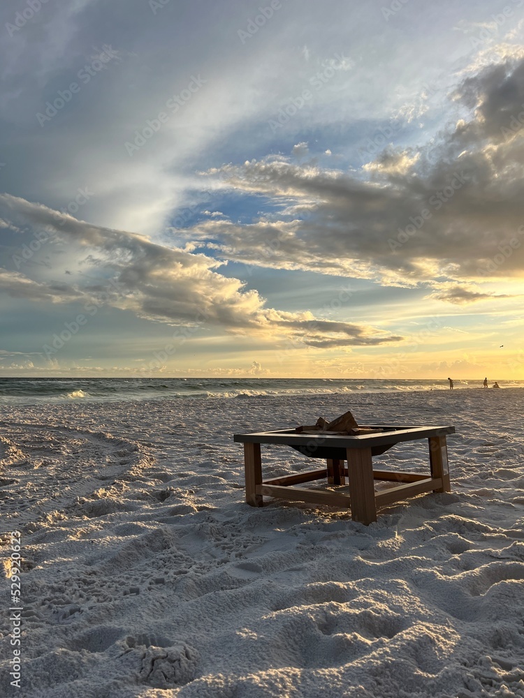 Fire pit and sunset on Florida white sand beach 