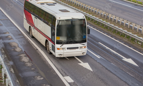 Bus moves along the suburban highway