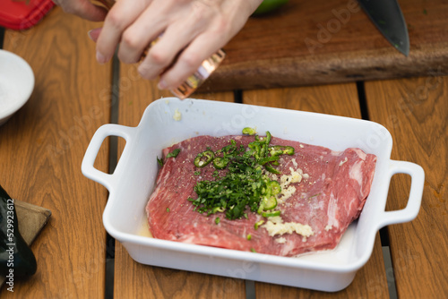 Seasoning flank steak photo