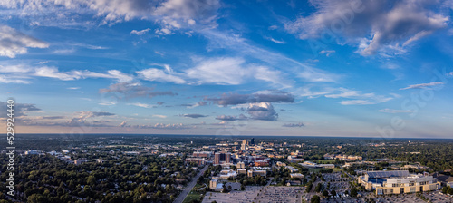 Aerial panorama of Lexington, KY downtown district. University of Kentucky campus on the foreground with the stadium field and parking lot in the bottom right corner photo