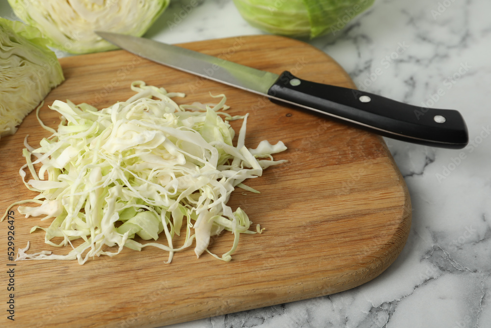 Chopped ripe cabbage on white marble table, closeup Chopped ripe cabbage on white marble table, closeup