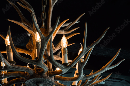 Fotografering Wooden chandelier in a shape of antlers