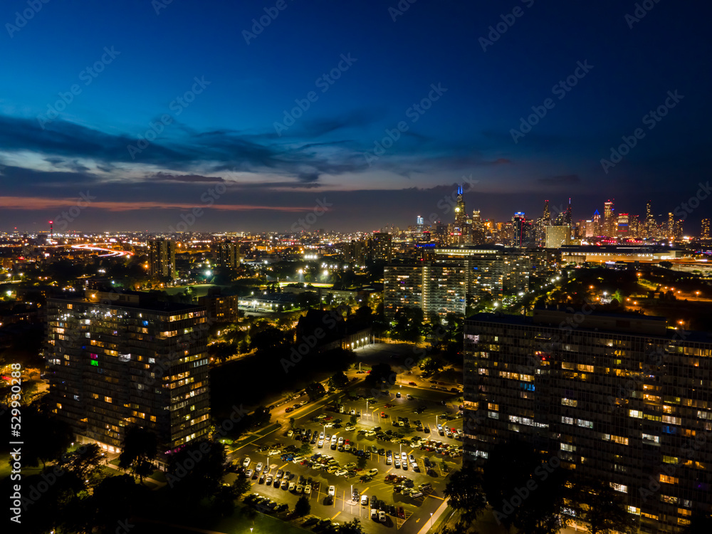 establishing aerial drone night time view of the Chicago skyline metropolis. the cityscape has beautiful architecture that tourist can sightsee.