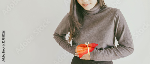 woman with liver pain, hepatitis vaccination, liver cancer treatment, world hepatitis day photo