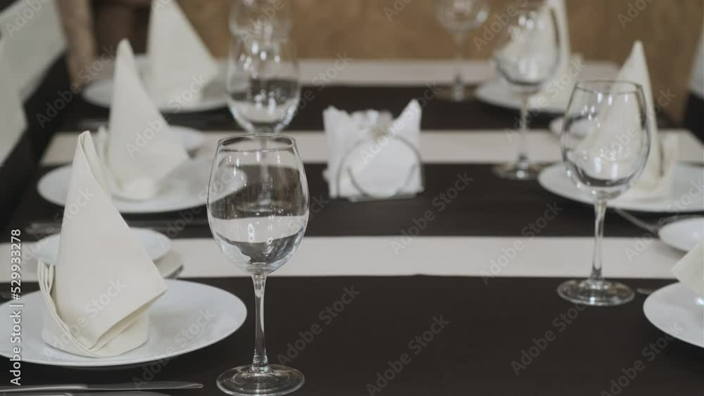 Banquet table with wineglasses. High angle of elegant banquet table served for wedding celebration Banquet table with wineglasses. High angle of elegant banquet table served for wedding celebration