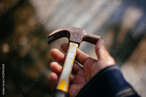 holding hammer in hand
