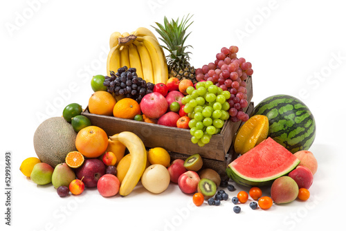 Fototapeta Naklejka Na Ścianę i Meble -  wooden crate fill up with different fresh fruits on white background.