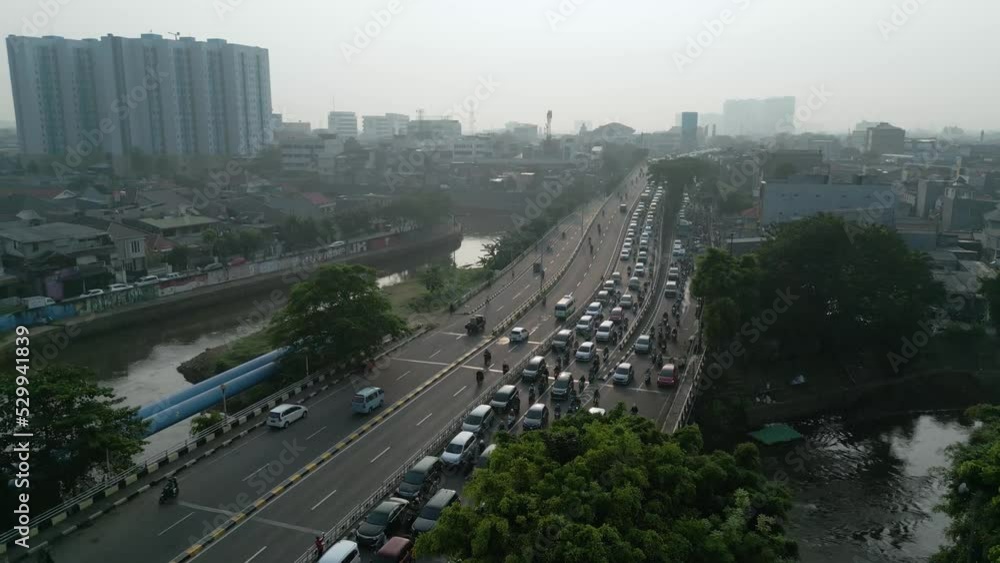 Aerial view of queued vehicles moving on overpass Aerial view of queued vehicles moving on overpass
