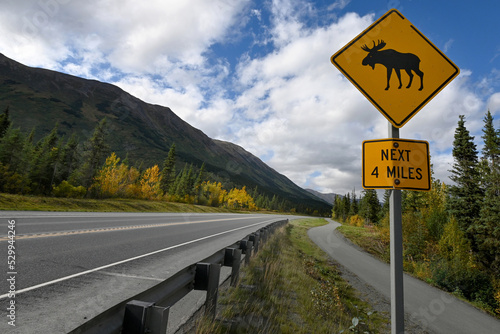 Alaska road sign cautions drivers to watch for moose on the roadway.