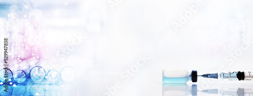glass flask and beaker with orange drop solution in chemistry science research lab white banner background