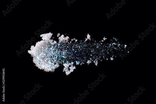 Pearl glitter makeup product smear on black. Eye shadow, lip gloss and face for holiday makeup swatch
