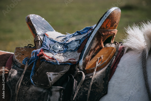 Details of a tradtionnal mongolian horse saddle with silver stars in Mongolia photo