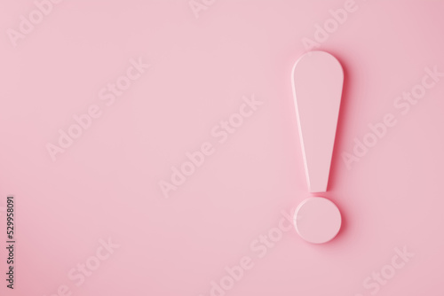 Exclamation mark on pink background with copy space. photo