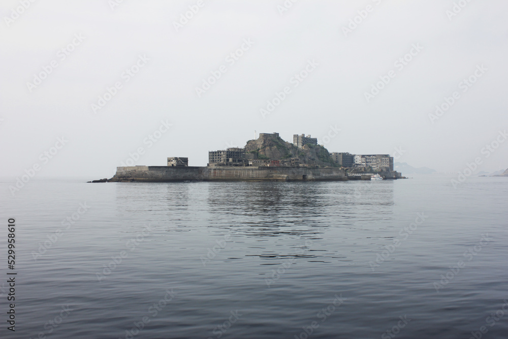 Battleship Island unique view from a distance. Ruins of Hashima Island Japan