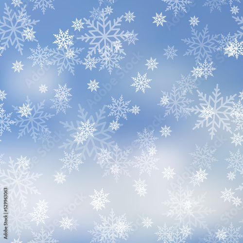 Winter snowfall and snowflakes on light blue background. Xmas and New Year background. Vector