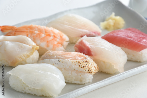 Sushi Set nigiri sashimi and on white plate over white background-Jananese Food