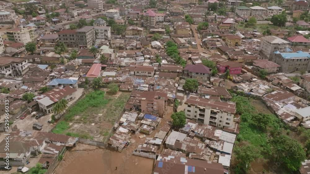 Aerial flyover during the day of buildings and neighborhoods in Freetown, Sierra Leone. Aerial flyover during the day of buildings and neighborhoods in Freetown, Sierra Leone.