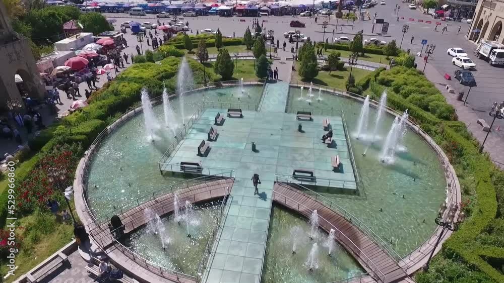 An aerial shot of the city of Erbil showing the ancient Erbil Citadel and the garden opposite the castle with water fountains and the popular market An aerial shot of the city of Erbil showing the ancient Erbil Citadel and the garden opposite the castle with water fountains and the popular market