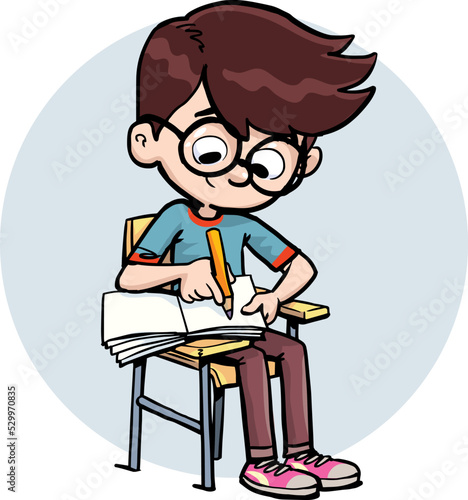 boy writes in a notebook while sitting in class