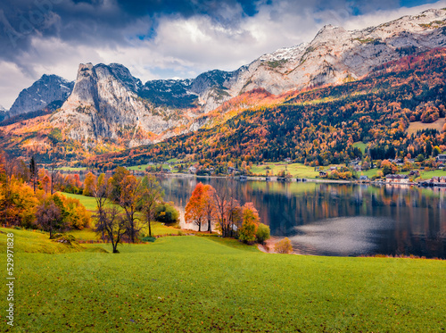 Calm autumn view of Grundlsee lake with huge mountain range on background. Colorful morning scene of Brauhof village, Styria stare of Austria, Europe. Traveling concept background..