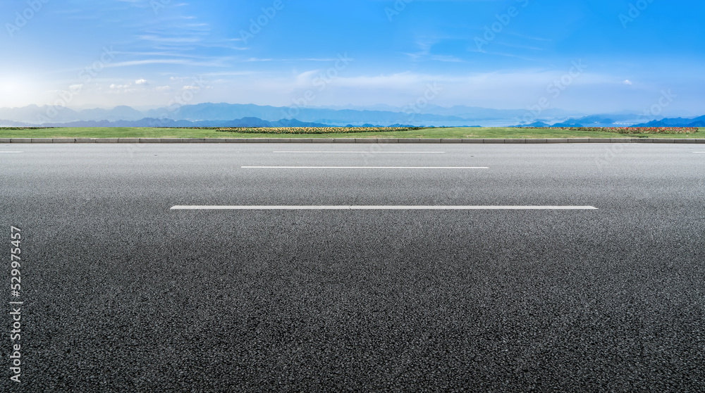 Fototapeta premium Empty road and city buildings background