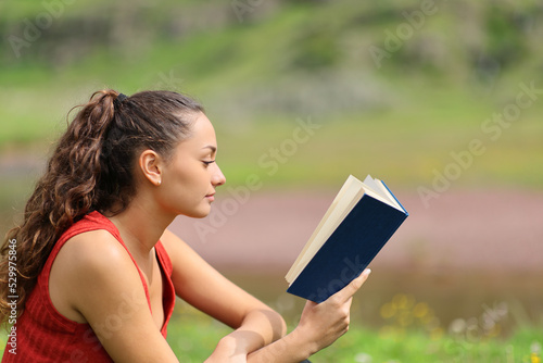 Woman reading a book relaxed in the mountain