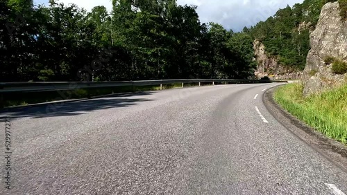 Wallpaper Mural First person view of a nordic road, Norway, lush green contryside Torontodigital.ca