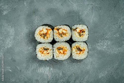 Maki sushi roll with eel on a gray background. Selective Focus. Sushi Menu