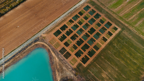 Seed testing field by turquoise lake photo