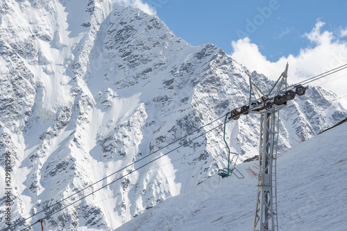 Cable car against the backdrop of the snow-capped Caucasus mountains, glacier seven © Марем Гукежев
