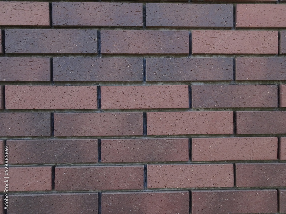 Obraz premium 細長い煉瓦色の横向きの長方形の壁のテクスチャー