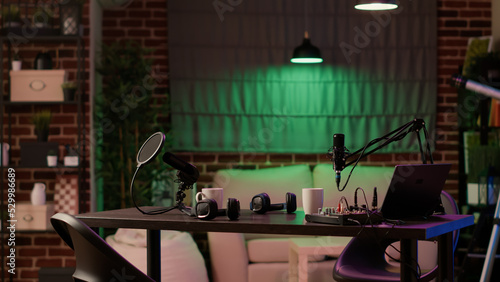 Bild auf Leinwand Nobody in cozy ambient room with podcast equipment, microphone and headphones for interview broadcasting