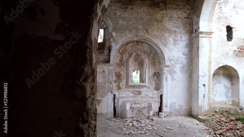 Aerial video of an abandoned convent in a state of disrepair. It is snowing outside. Called the Convento dei Frati Cappuccini, and dates from the 16th century. Located in Grottole, southern Italy. photo