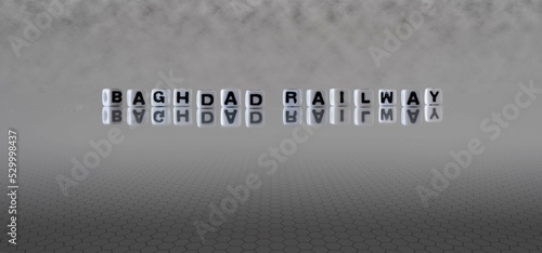 baghdad railway word or concept represented by black and white letter cubes on a grey horizon background stretching to infinity