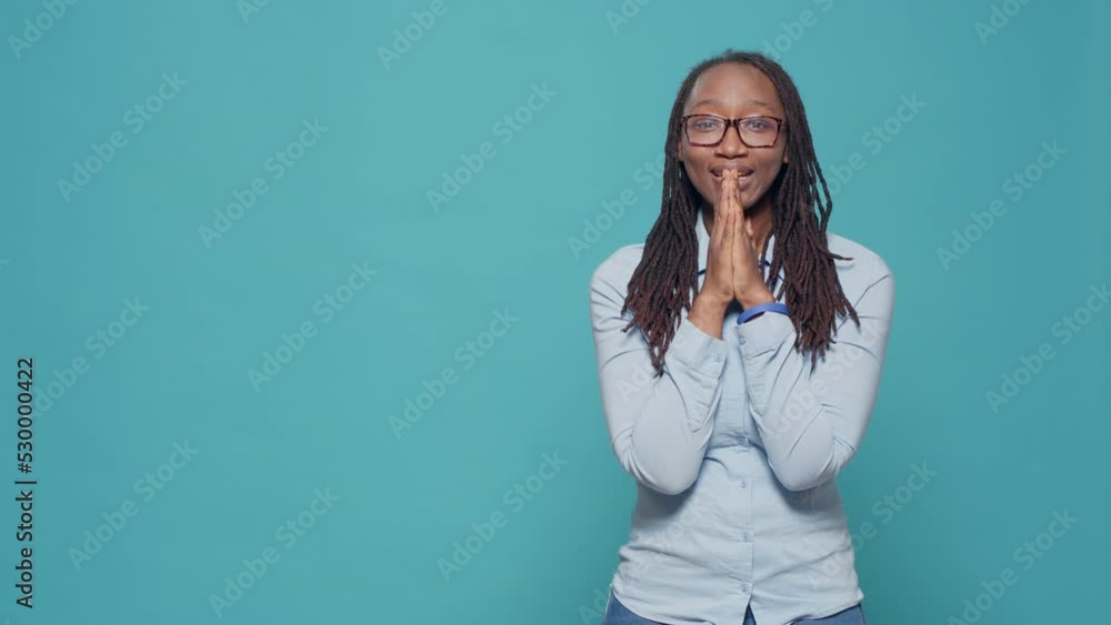 African american model doing prayer hands on camera, begging and asking for good luck and fortune. Woman waiting for wish or request and imploring for desire, having expectations. African american model doing prayer hands on camera, begging and asking for good luck and fortune. Woman waiting for wish or request and imploring for desire, having expectations.