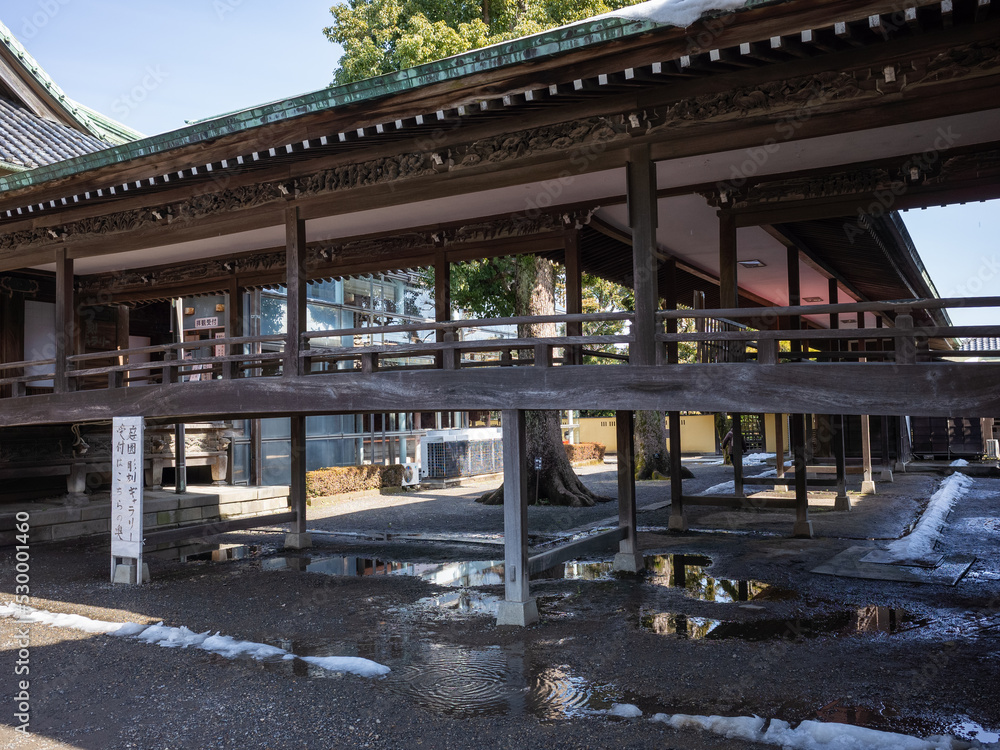 wooden path of taishakuten temple and wet ground wooden path of taishakuten temple and wet ground