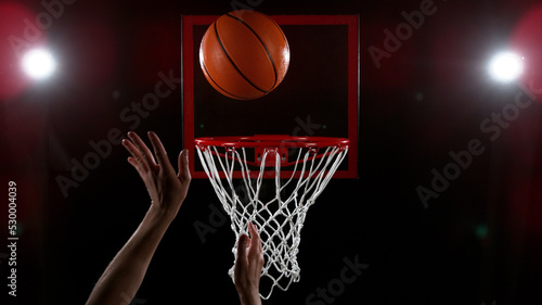 Detail of basketball player scoring.