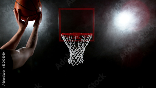 Detail of basketball player scoring.