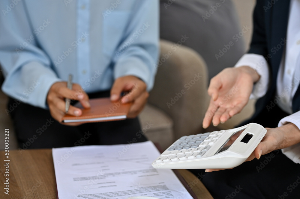 Talented female real estate agent or realtor meets with her client to finalize the deal Talented female real estate agent or realtor meets with her client to finalize the deal
