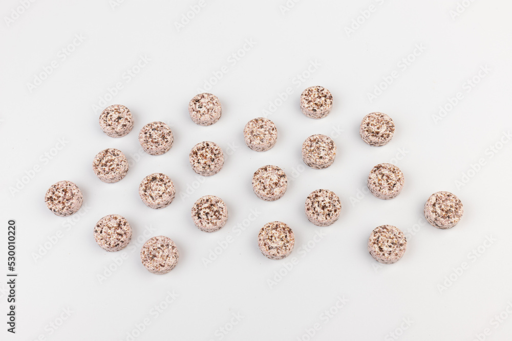 Heap of medicine colored pills, tablets on a white background Heap of medicine colored pills, tablets on a white background