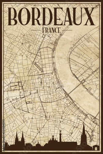 Black printout streets network map with city skyline of the downtown BORDEAUX, FRANCE on a vintage paper framed background