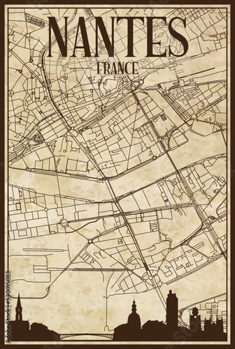 Black printout streets network map with city skyline of the downtown NANTES, FRANCE on a vintage paper framed background