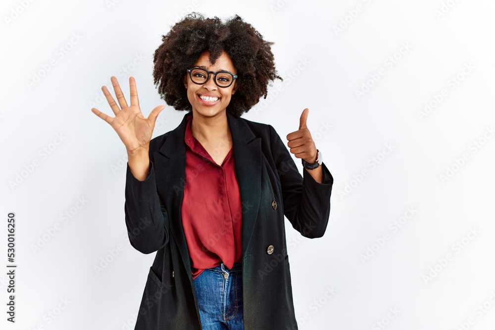 African american woman with afro hair wearing business jacket and glasses showing and pointing up with fingers number six while smiling confident and happy. African american woman with afro hair wearing business jacket and glasses showing and pointing up with fingers number six while smiling confident and happy.