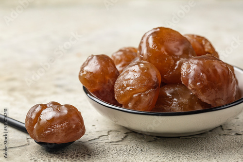 Chestnut candied sugar syrup and glazed or marron glacé,  confection, originating in northern Italy and southern France. Close up. photo