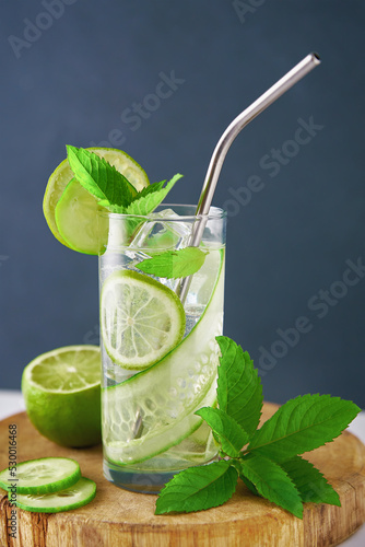 Cucumber, lime and mint lemonade. Refresment summer drink, Glass of detox water for dieting photo